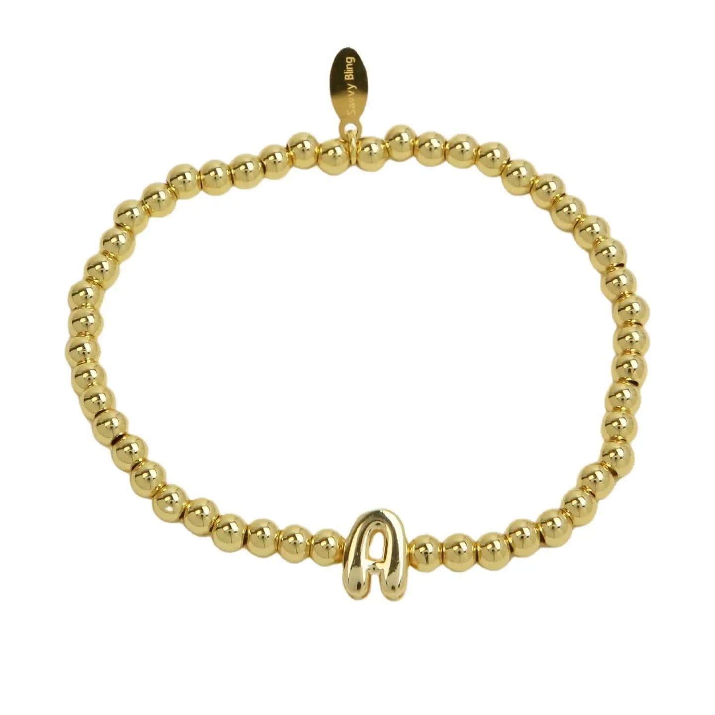 Gold beaded bracelet with a clasp on a white background