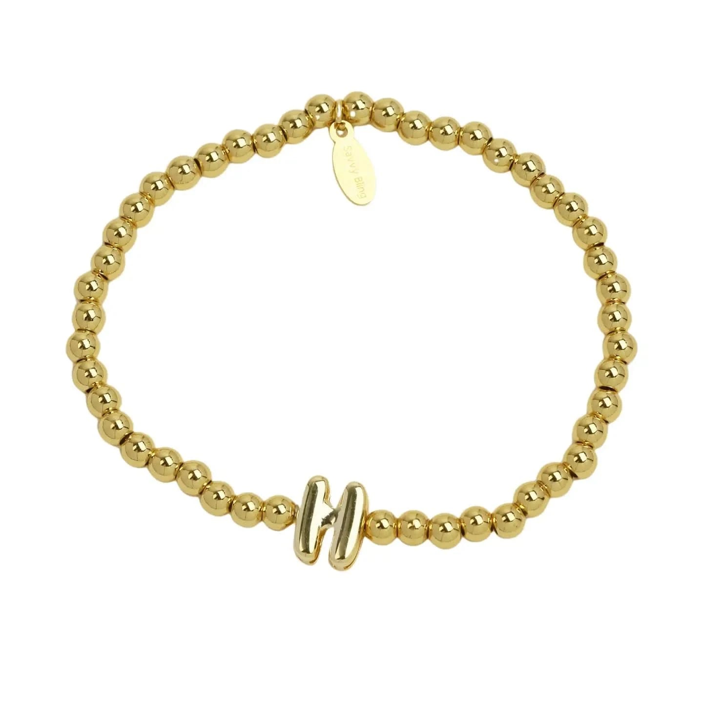 Gold beaded bracelet with a clasp on a white background