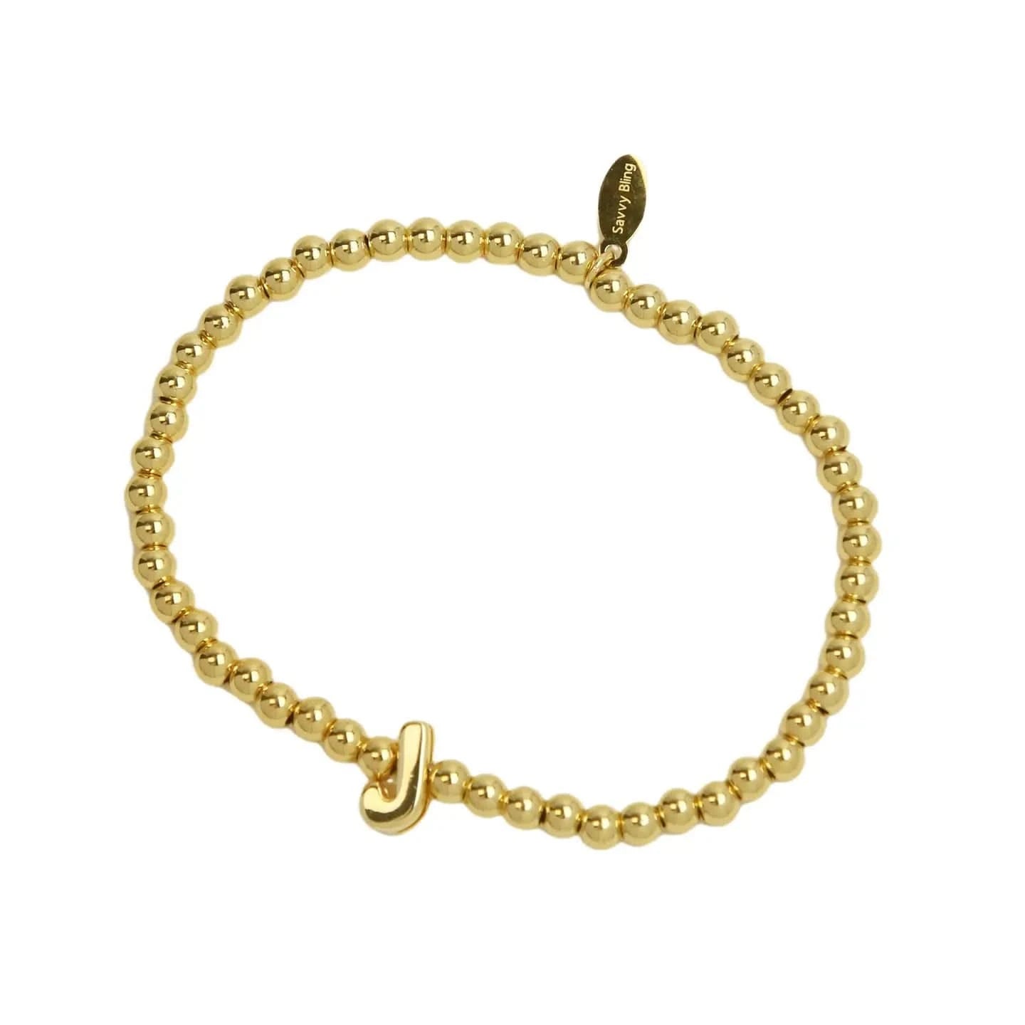 Gold beaded bracelet with a small gold clasp on a white background