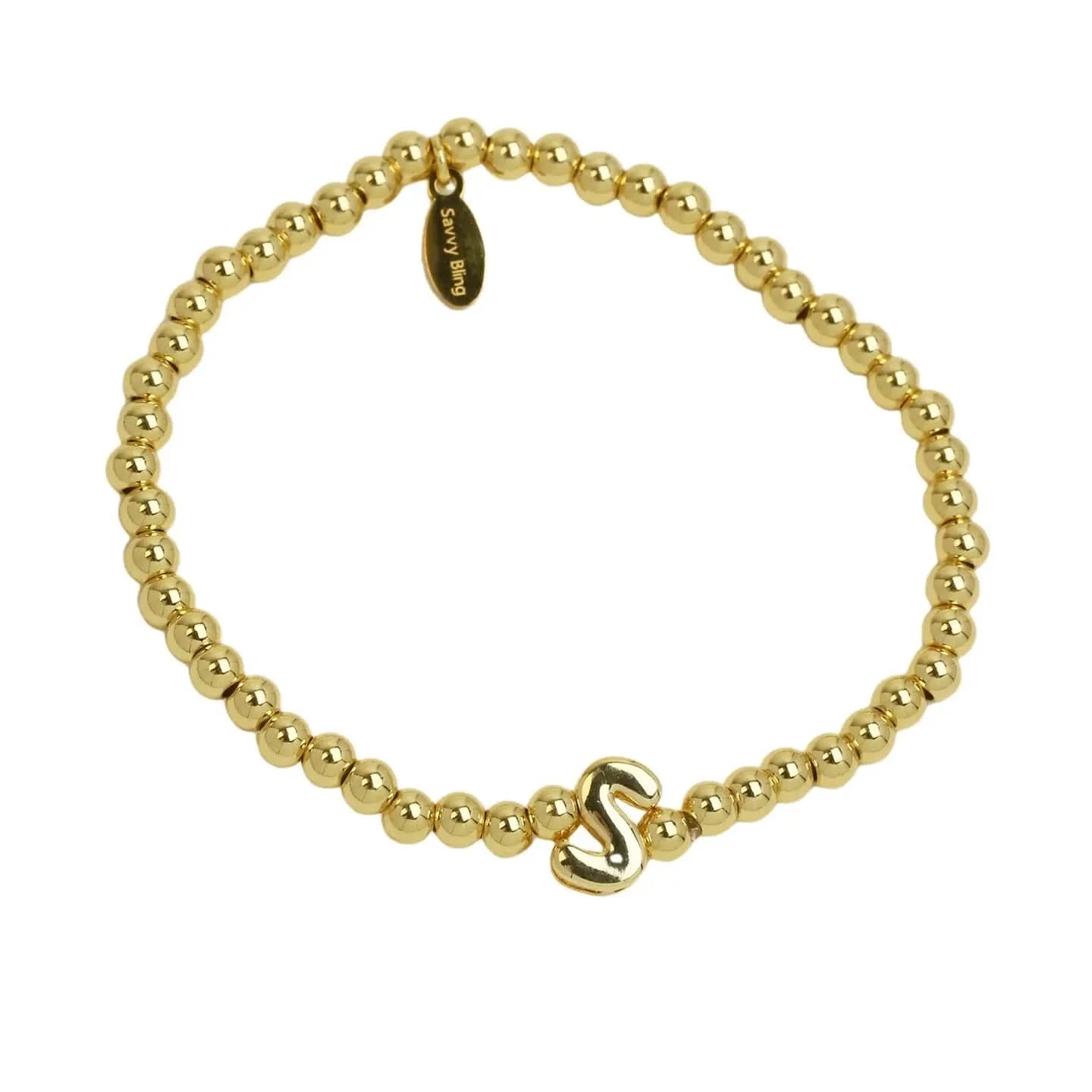 Gold beaded bracelet with a gold clasp on a white background