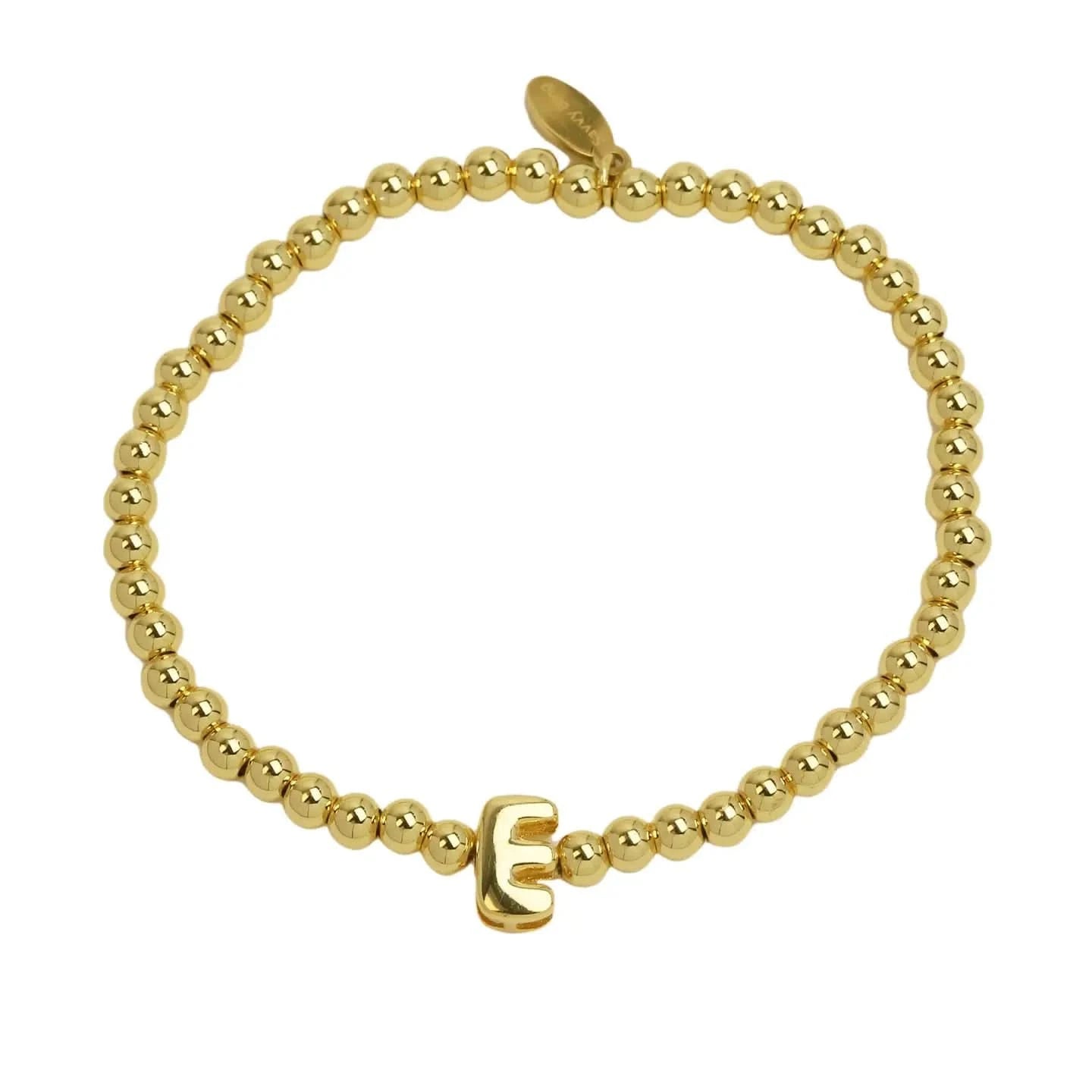 Gold beaded bracelet with a gold clasp on a white background