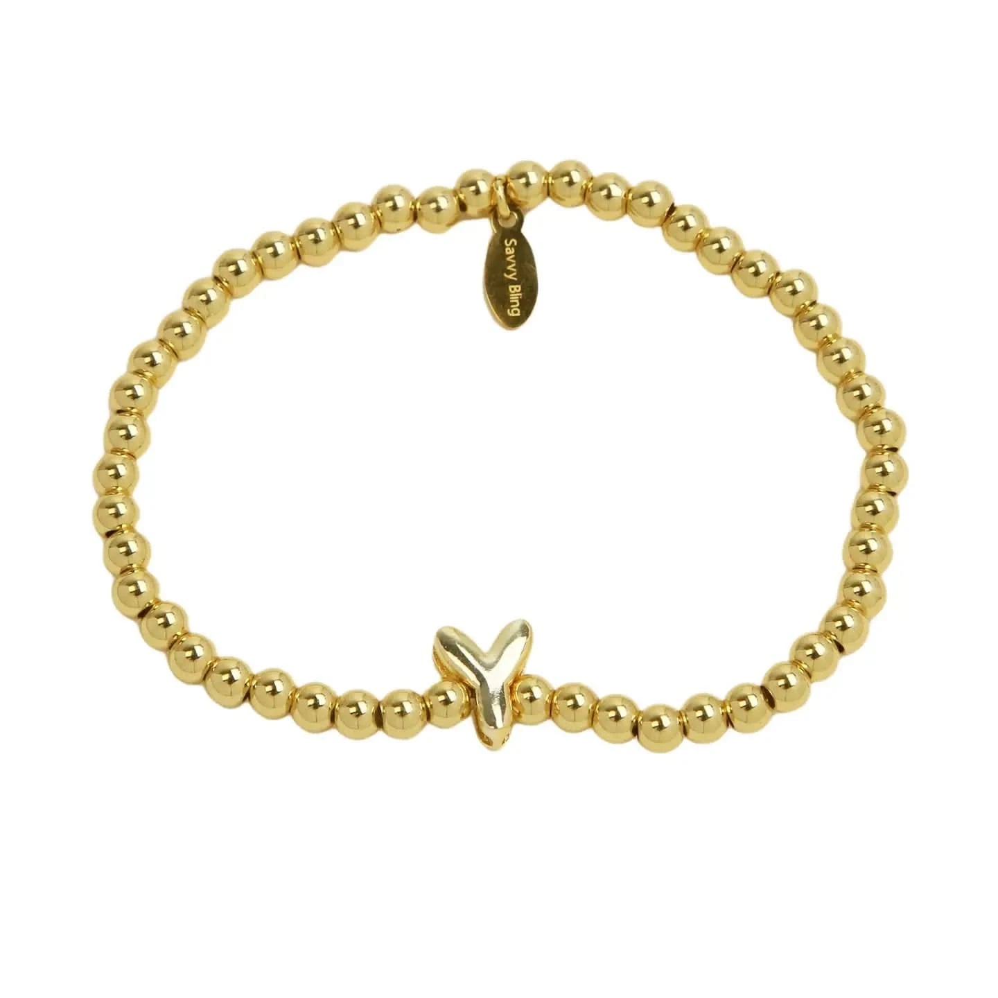 Gold beaded bracelet with a butterfly charm on a white background