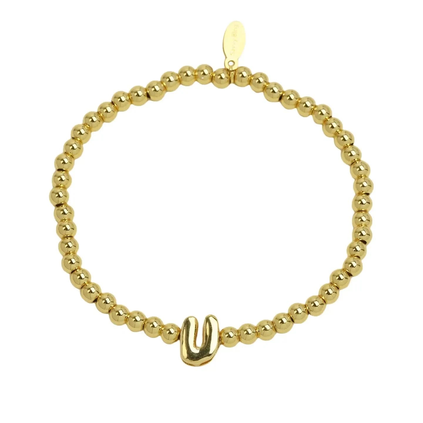 Gold beaded bracelet with a unique clasp on a white background