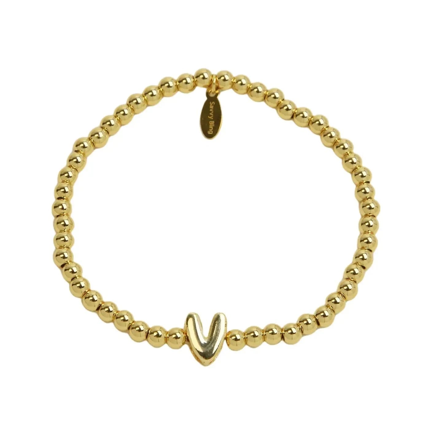 Gold beaded bracelet with a unique clasp on a white background