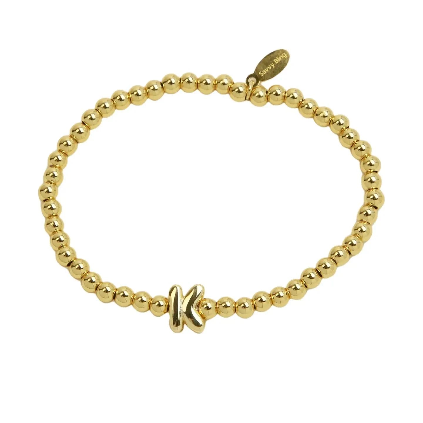 Gold beaded bracelet on a white background