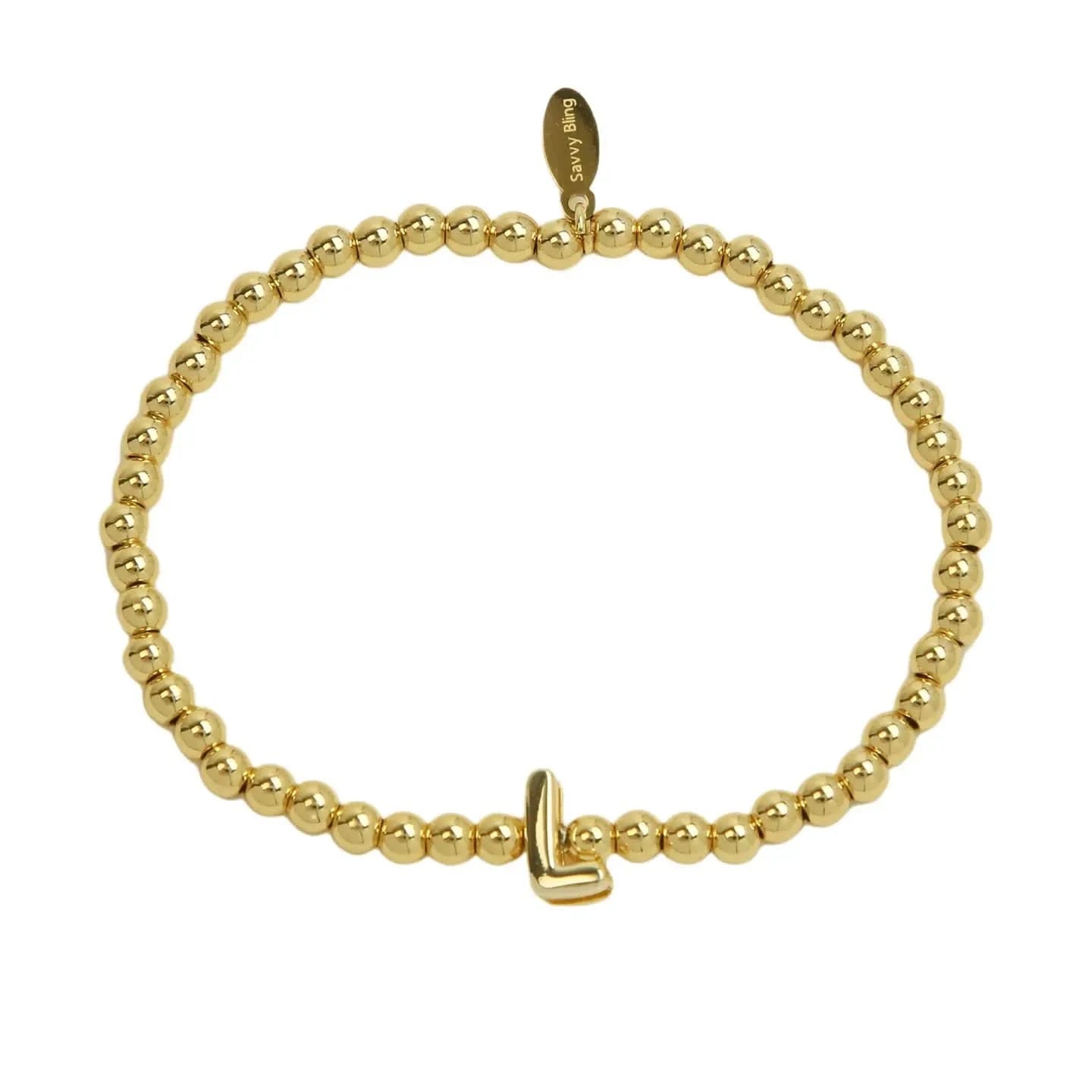 Gold beaded bracelet with a gold clasp on a white background