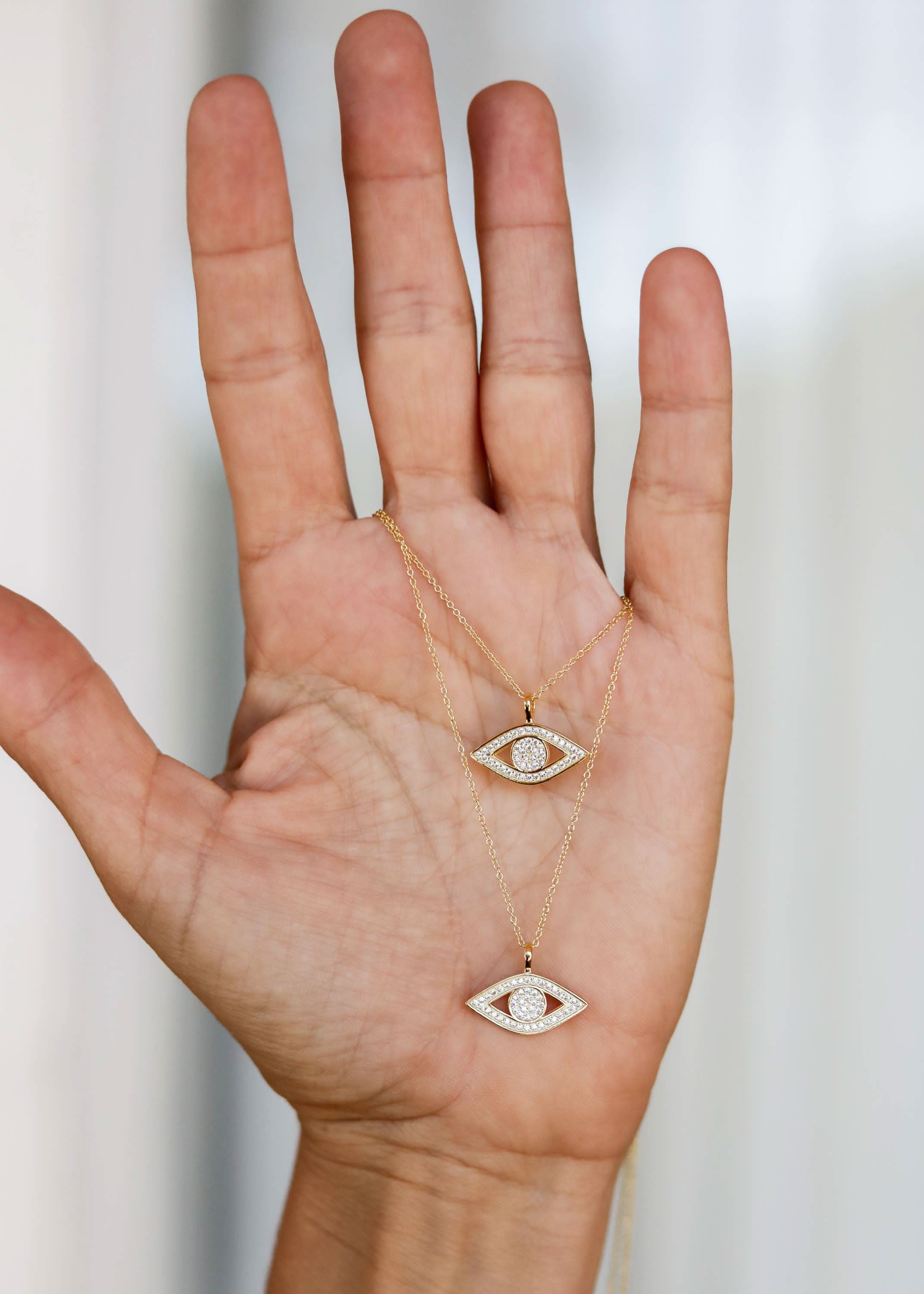 Two gold necklaces with eye-shaped pendants CZ Evil Eye Necklace two