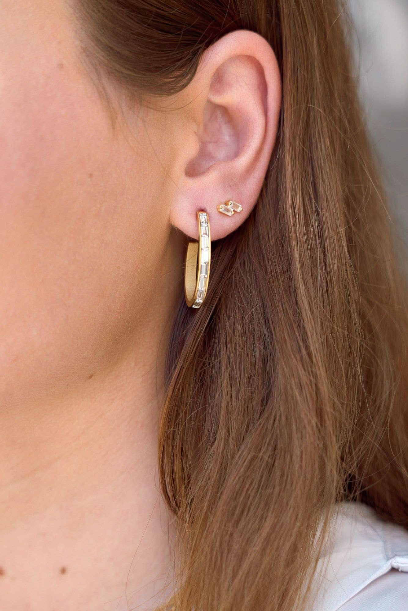 Woman wearing Pair of double Crystal gold micro stud earrings and hoops