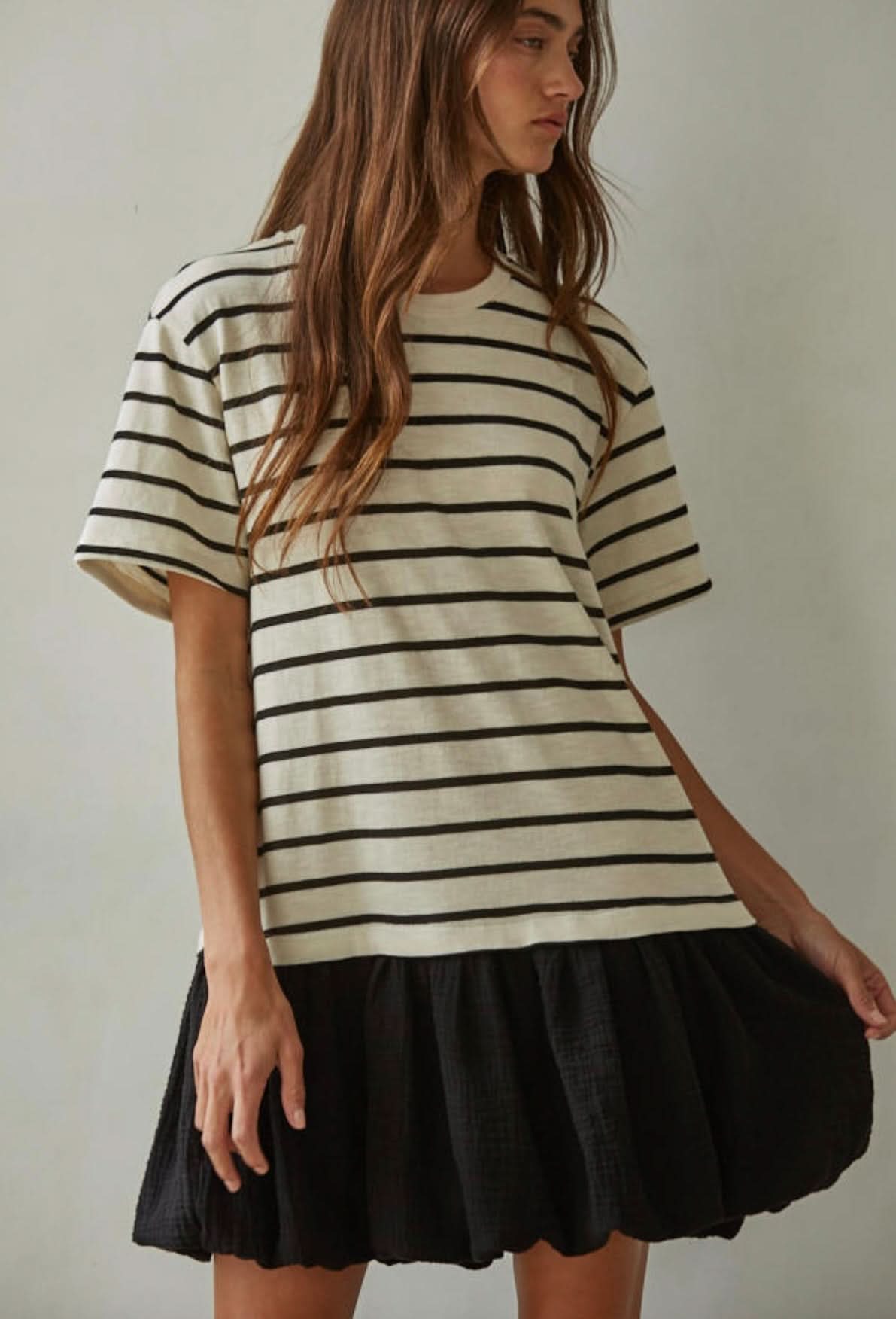 Woman wearing a striped dress white and black line design