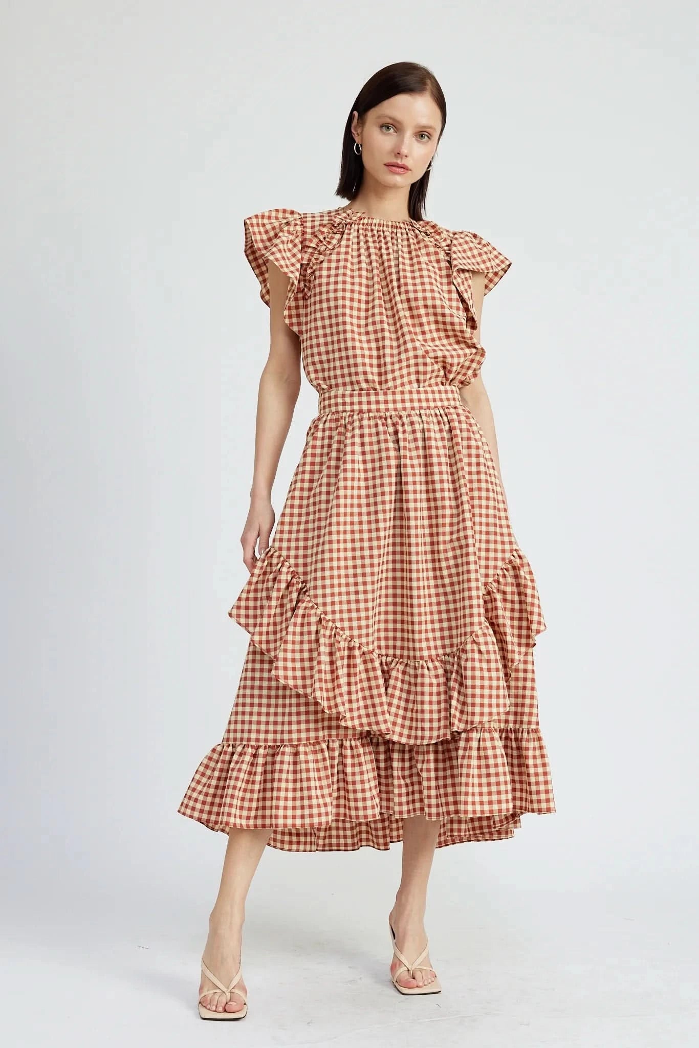 Woman wearing a red and white checkered dress 