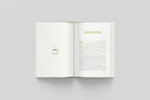 Book opened to page with coffee cup illustration and an introduction page 