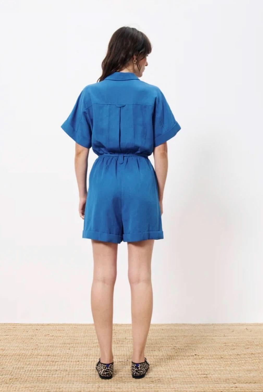Lily Jumpsuit features short sleeves with lapels and a removable slim belt