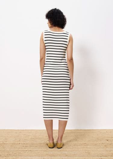 Person wearing a black and white striped dress against