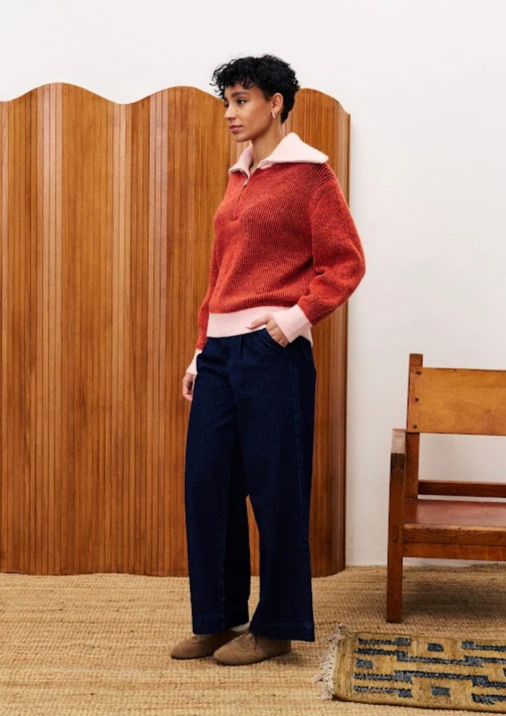 Women wearing a red sweater with Peter Pan or Polo-style collar