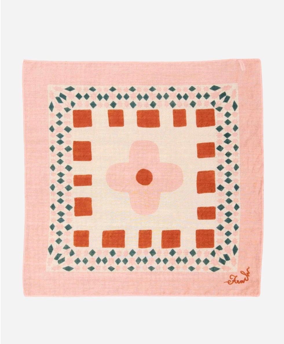 Quilt with geometric pattern on a pink background