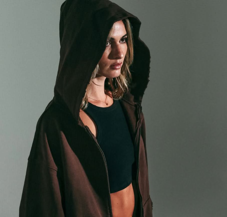 Woman wearing Vintage washed brown zip up cotton hoodie 