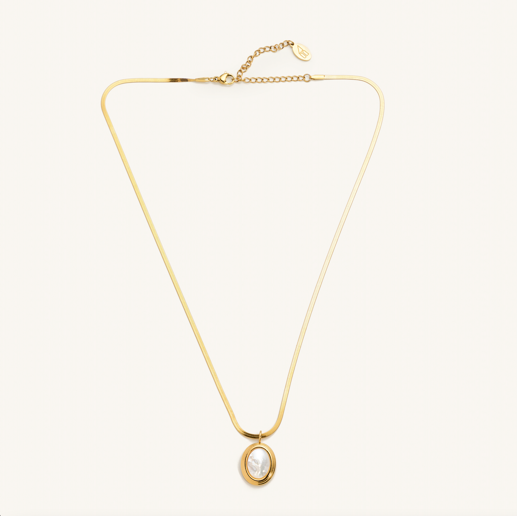 Gold pearl shell necklace with thin herringbone chain