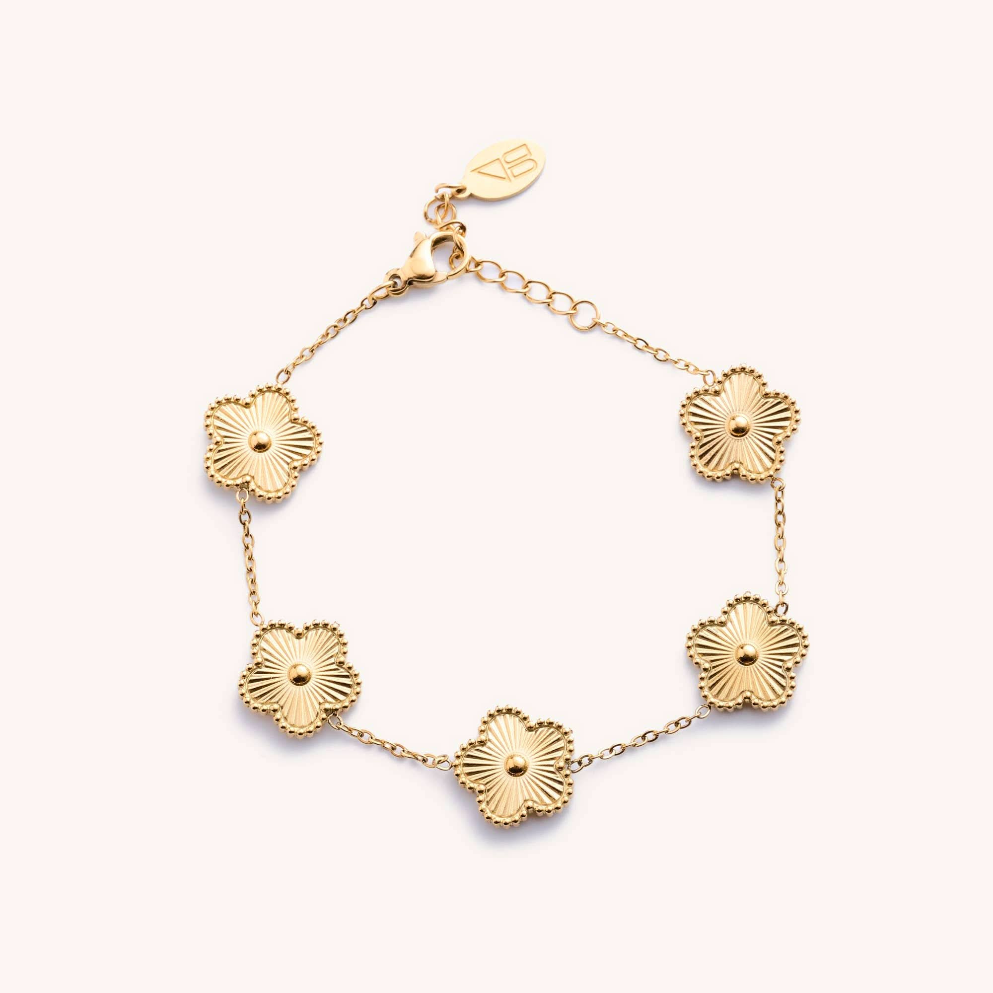 Gold bracelet with floral designs 