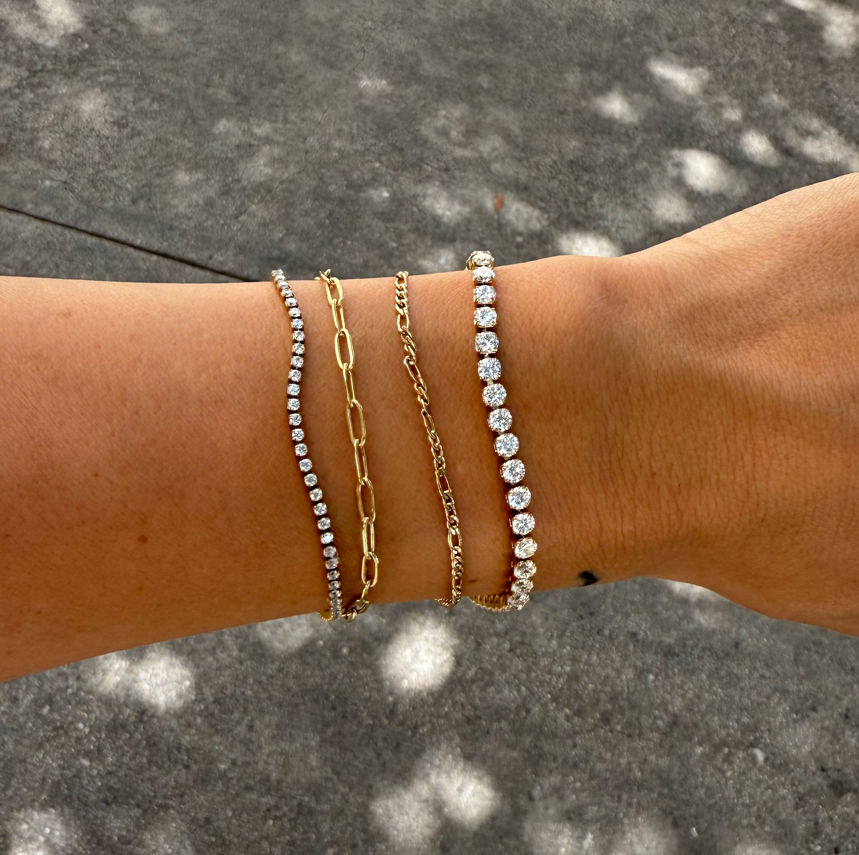 Woman wearing Dainty gold shimmer tennis bracelet 