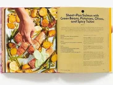 Sheet-pan salmon dish with green beans, potatoes, olives, and spicy tahini on a recipe card.