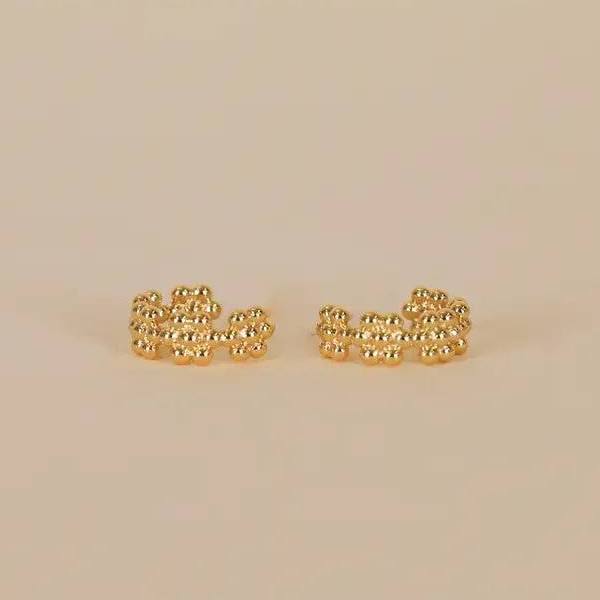 close up, lay flat gold flower hoop earrings