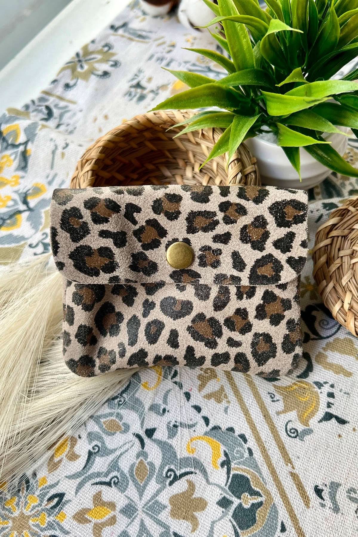 Small taupe leopard print metal wallet with over flap and gold button clasp 