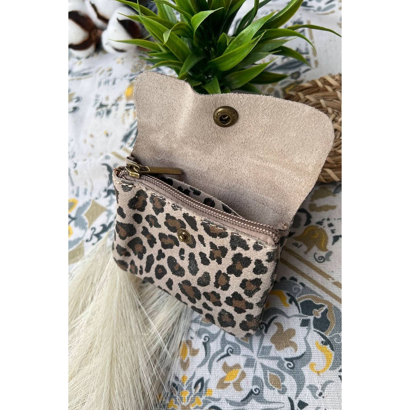 Open view of Small taupe leopard print metal wallet with over flap and gold button clasp 