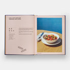 Recipe from the book of pasta titled- Fusilli with eggplant, tomatoes, and capers. Recipe on the left hand page and a picture of the dish on the right