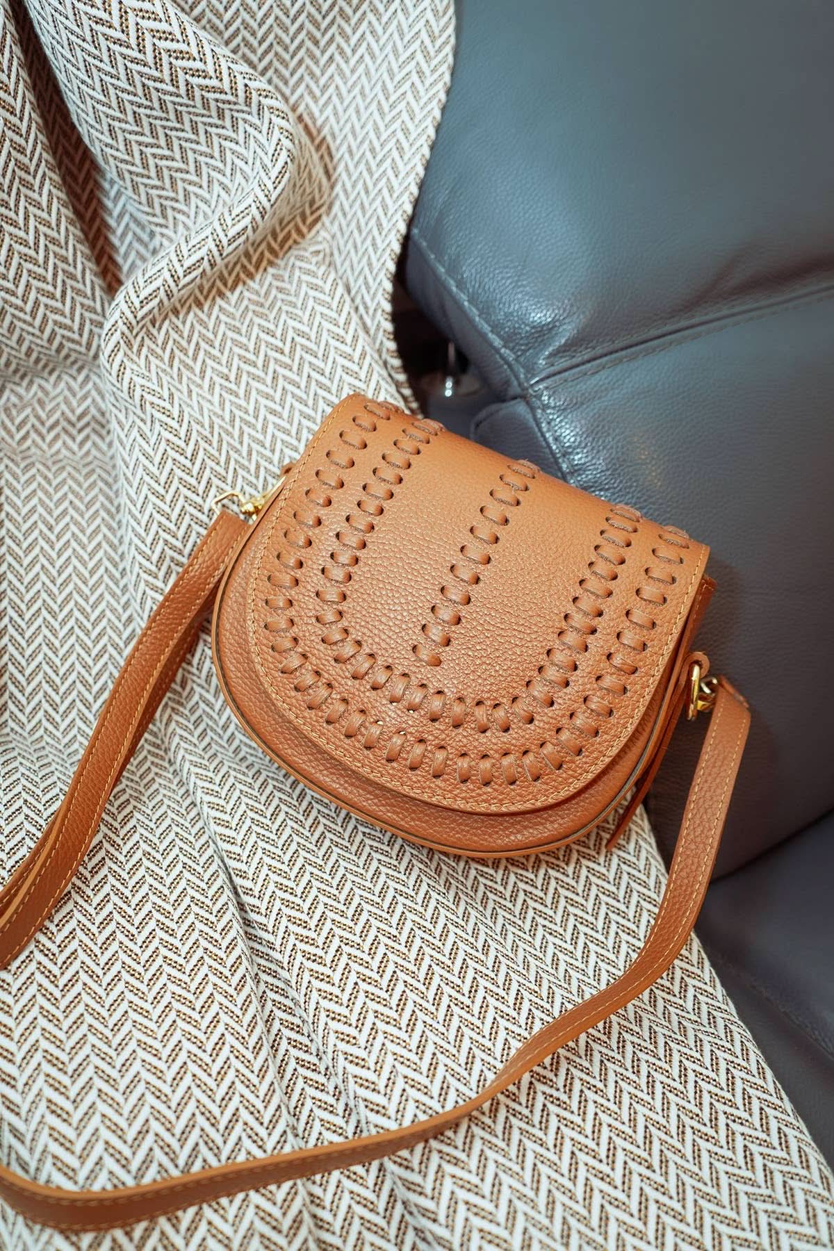 Chestnut brown colored leather crossbody bag with magnetic front clap and leather woven geometric design and gold Metal details 