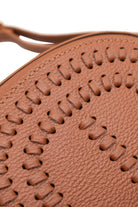 Woven details of Chestnut brown colored leather crossbody bag with magnetic front clap and leather woven geometric design and gold Metal details 
