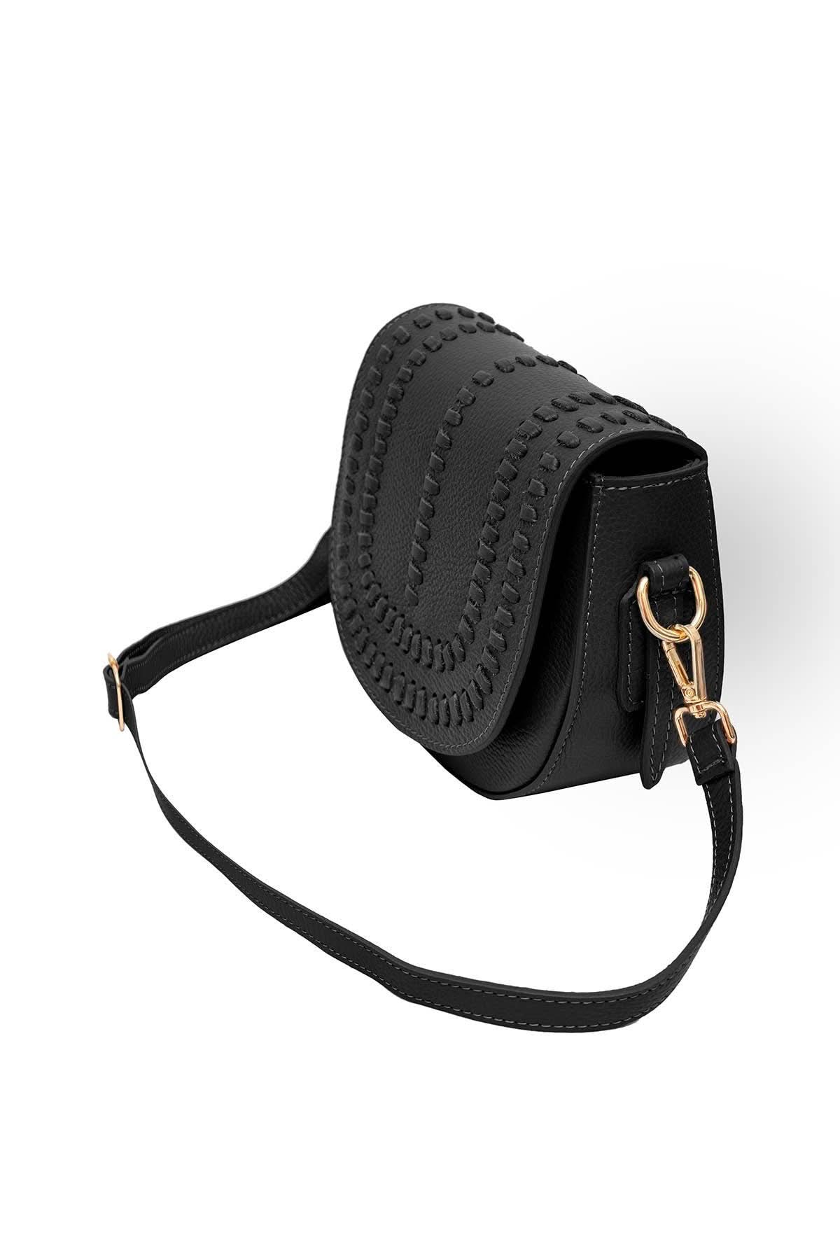 Black colored leather crossbody bag with magnetic front clap and leather woven geometric design and gold Metal details 
