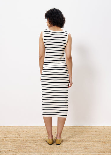 Woman wearing sleeveless long knit dress black and white stripe 