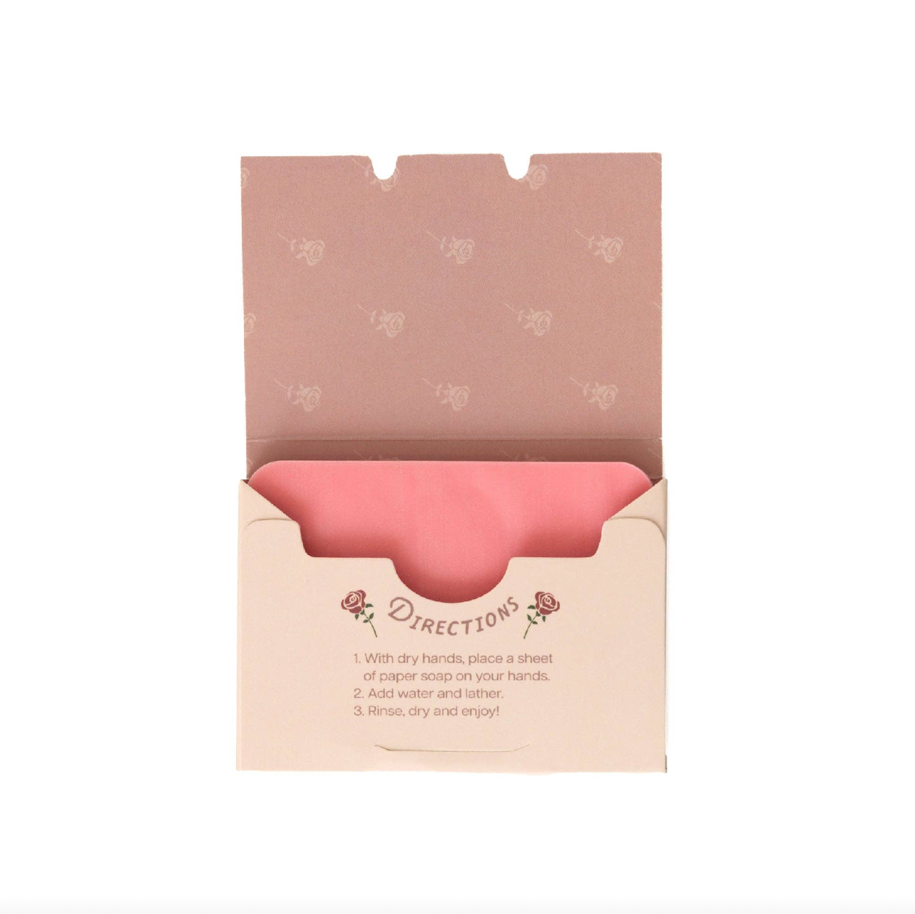 Pink paper soap sheet in an open beige box on a white background