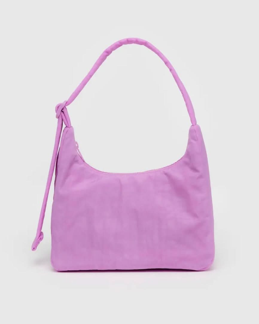 Purple shoulder bag on a light purple background