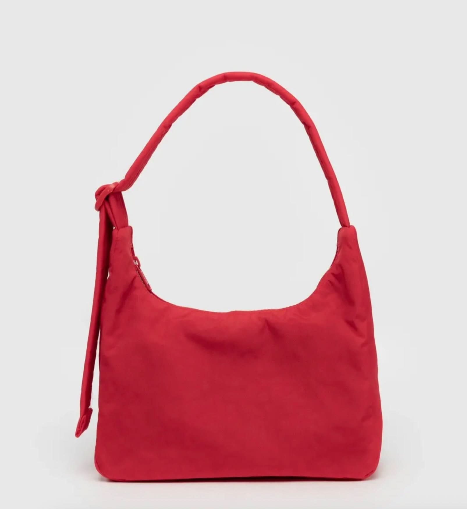 Red handbag on a light gray background