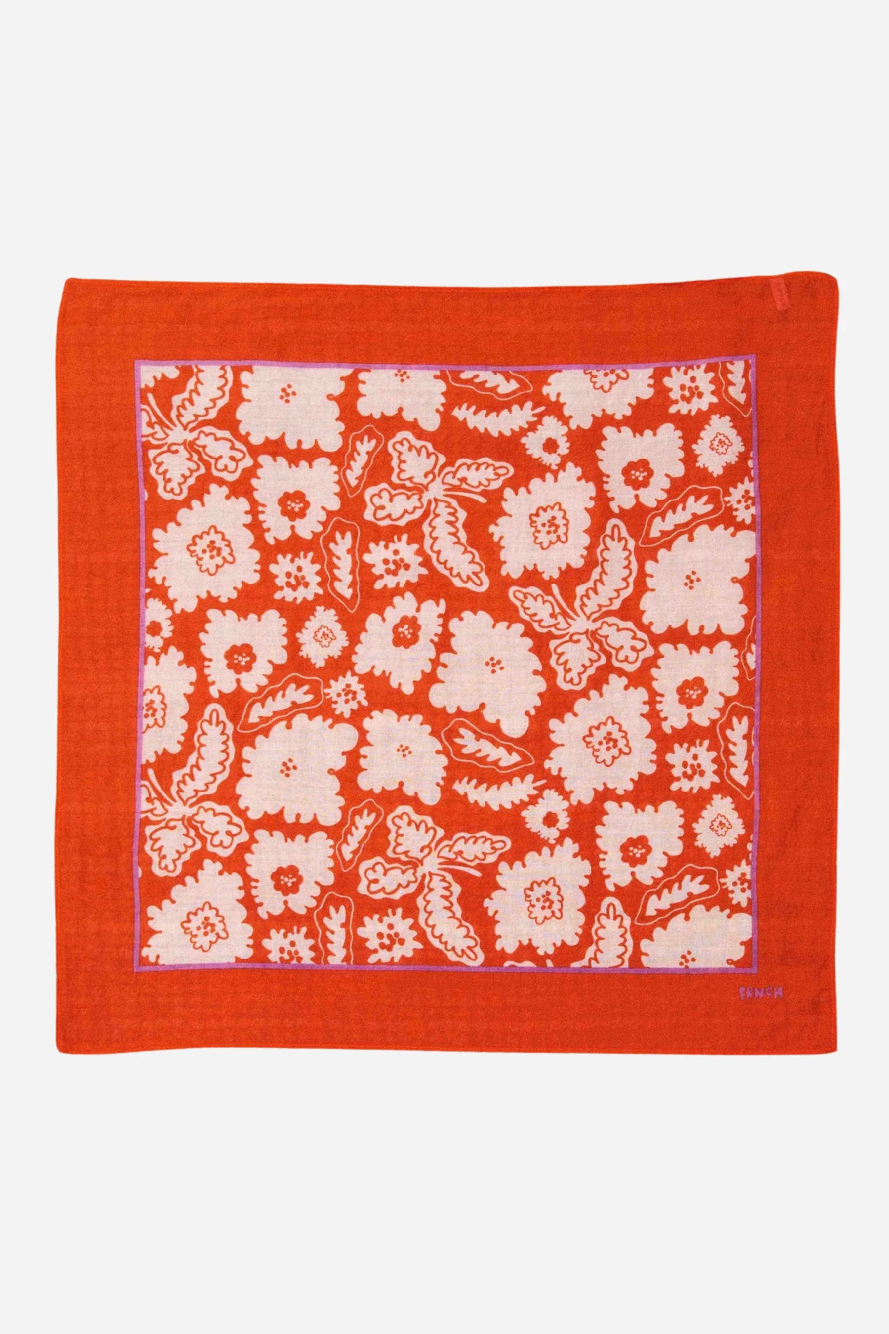 Red bandana with white floral pattern on a white background