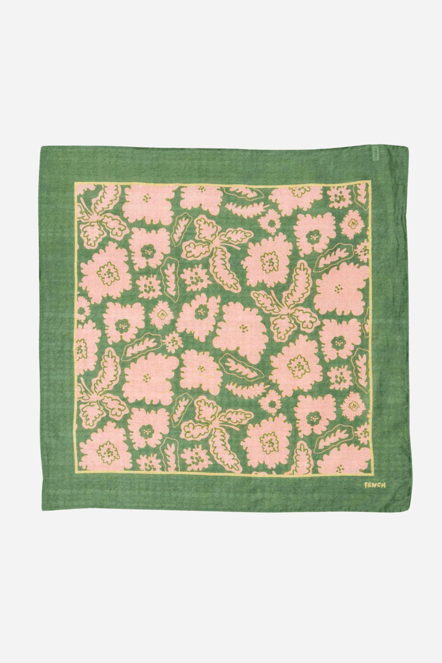 Green fabric square with pink floral pattern on a white background