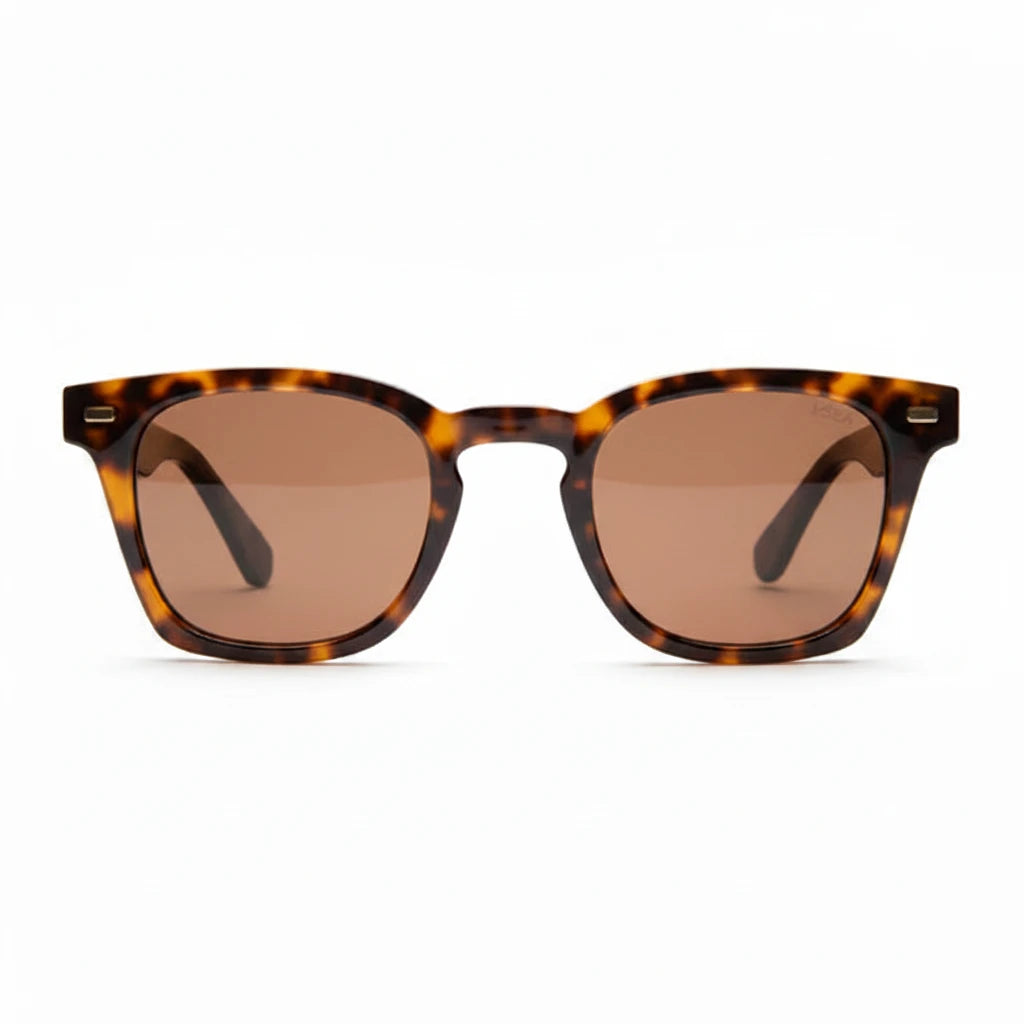 Sunglasses with tortoiseshell frame and brown lenses on a white background