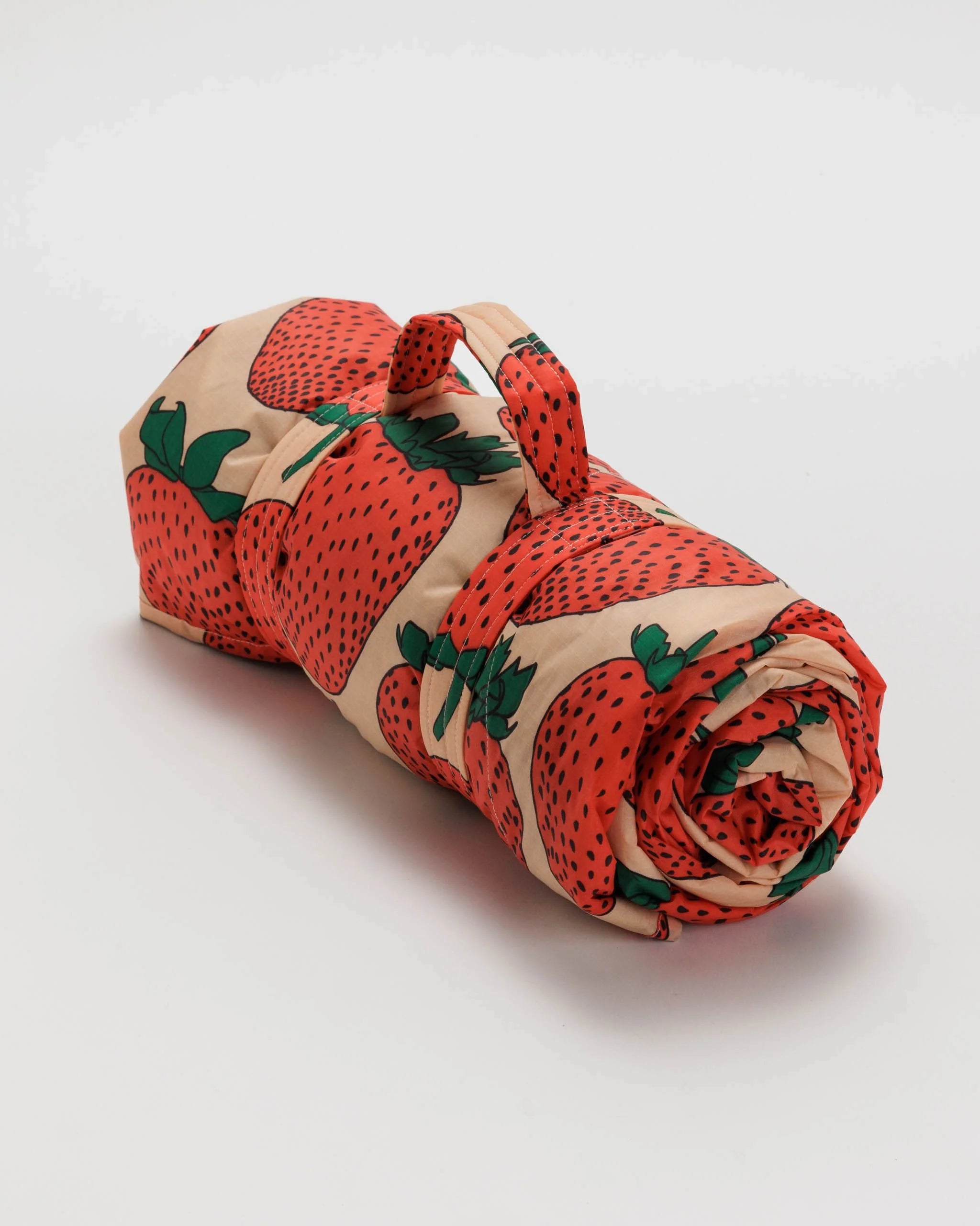 Roll of paper with strawberry pattern on a white background