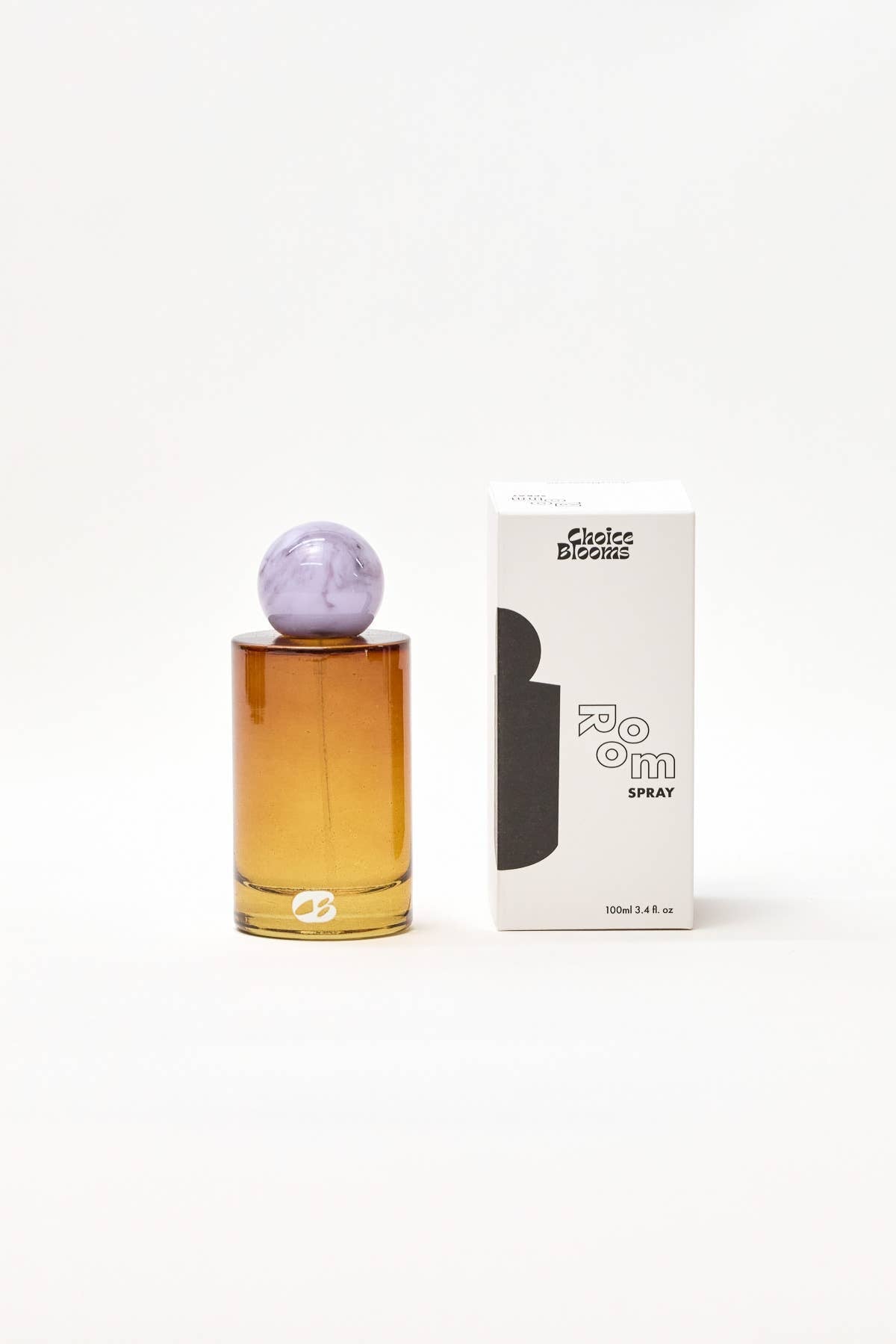 Perfume bottle with purple cap and packaging on a white background