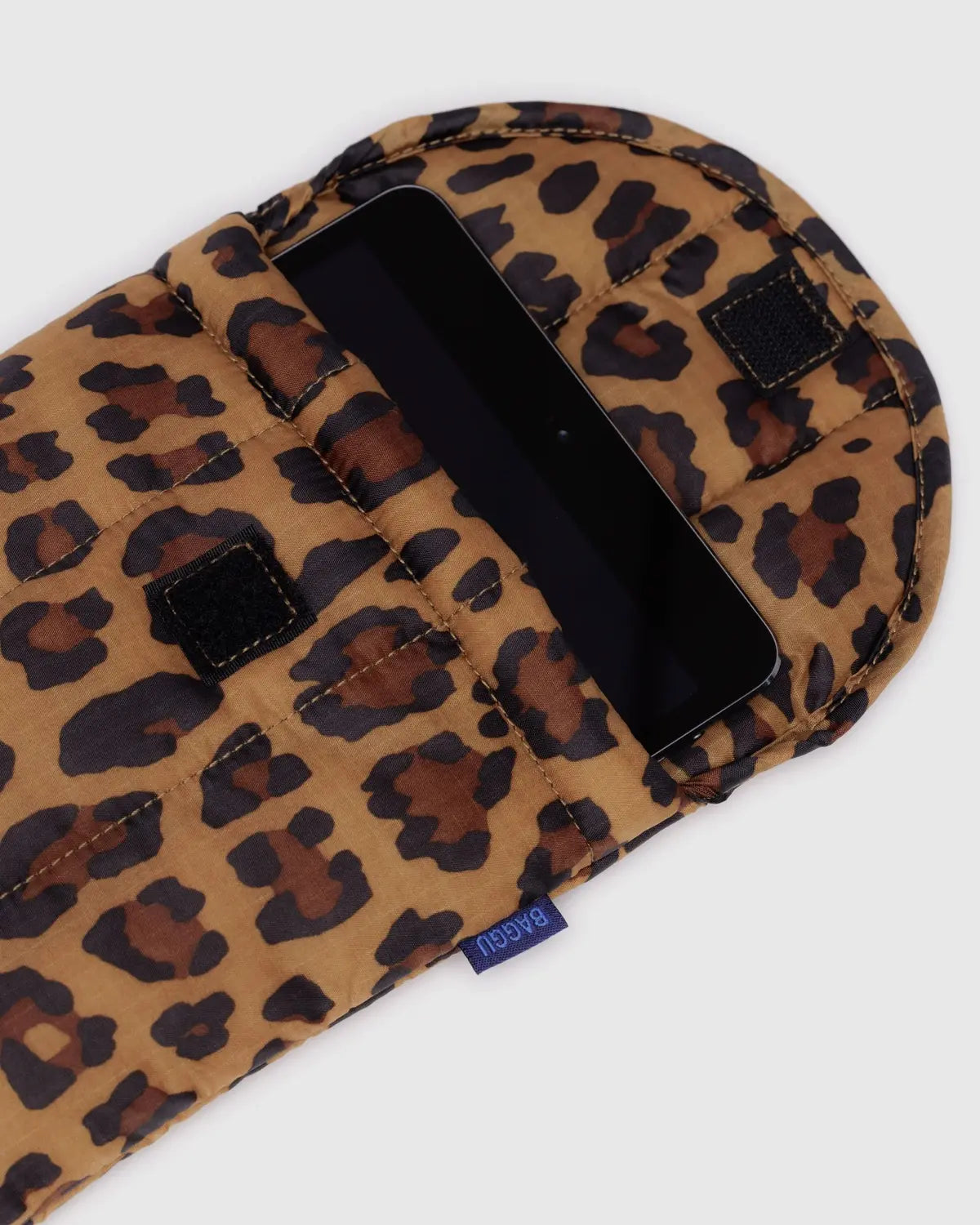 Leopard print phone case with a visible brand label on a white background