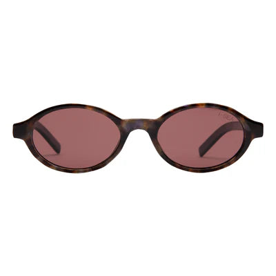 Sunglasses with tortoiseshell frame and red lenses on a white background