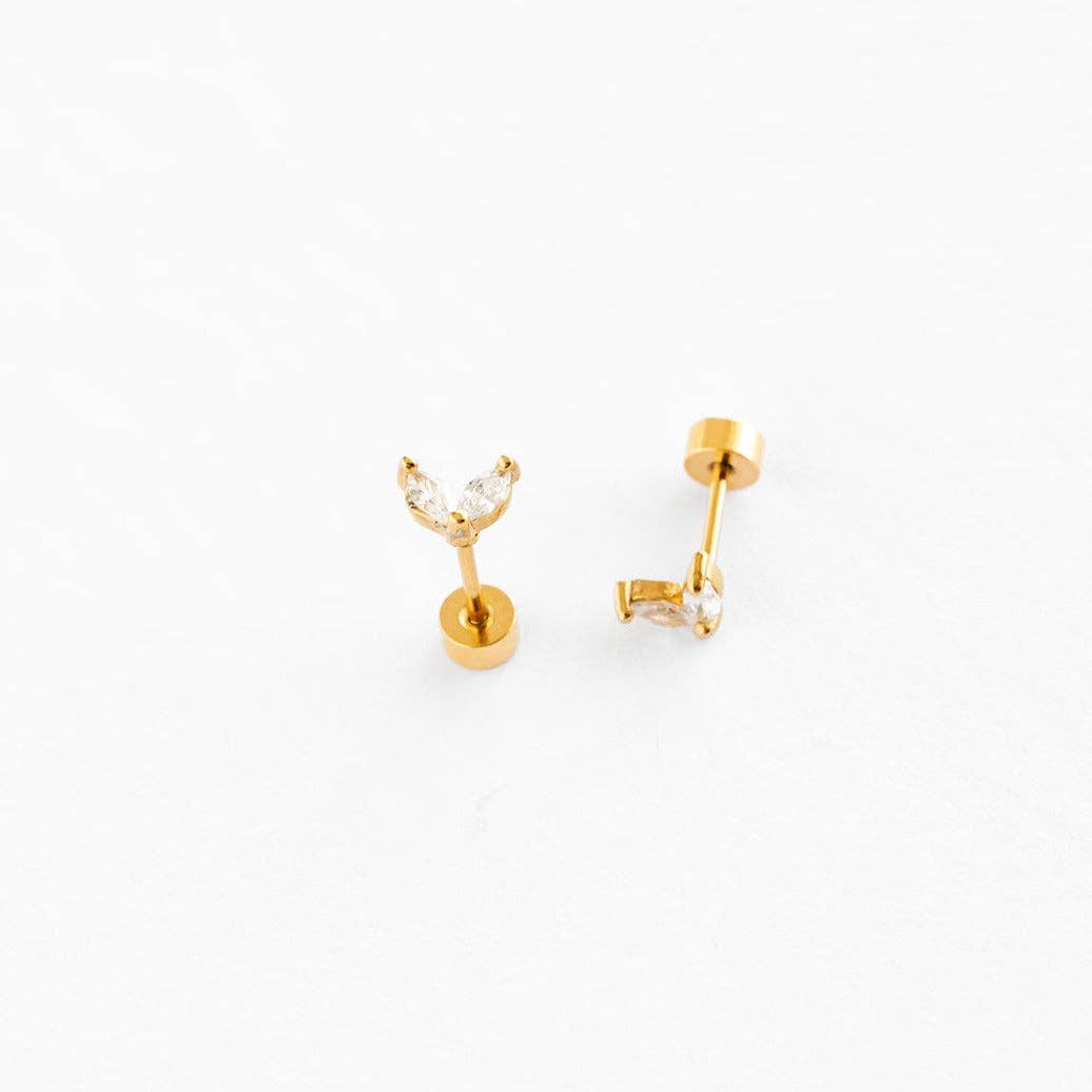Gold earrings on a white background