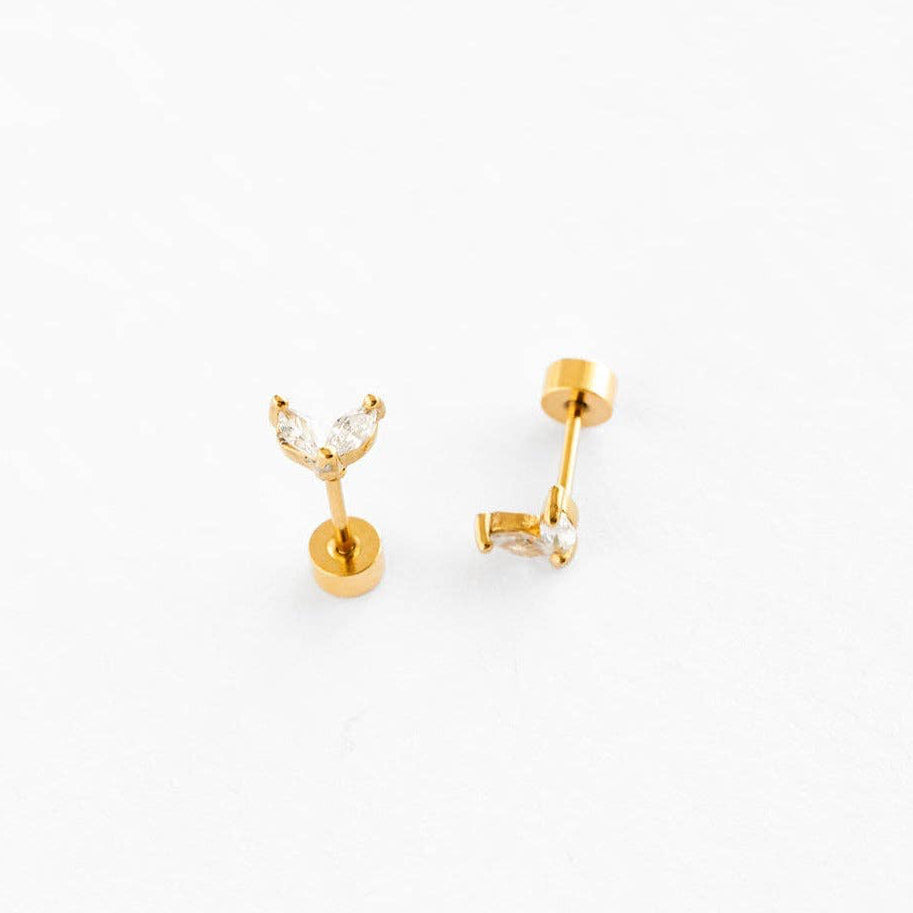 Gold earrings on a white background