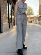 model wearing denim and cream striped vintage style pants 