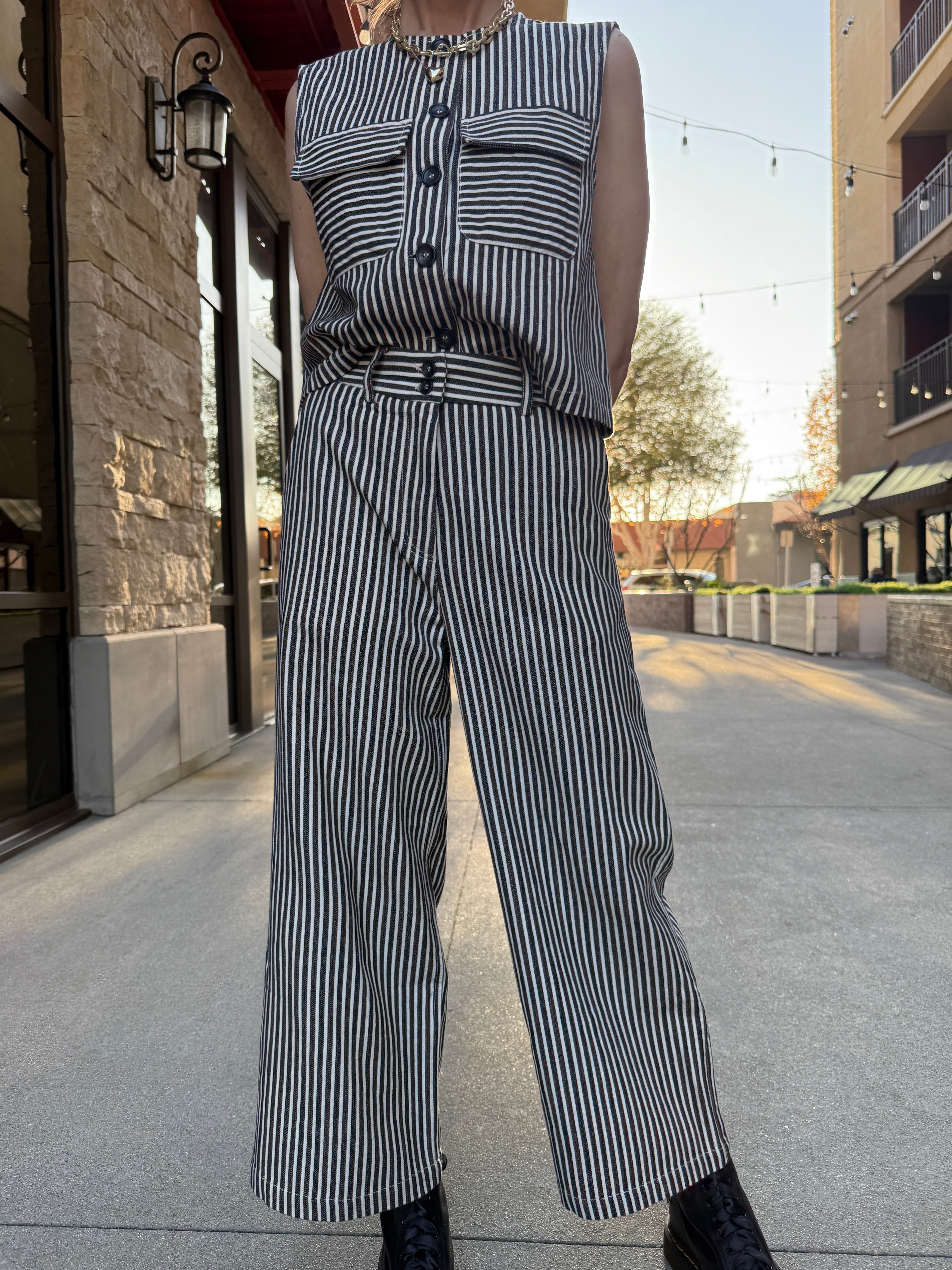 model wearing denim and cream striped vintage style pants 