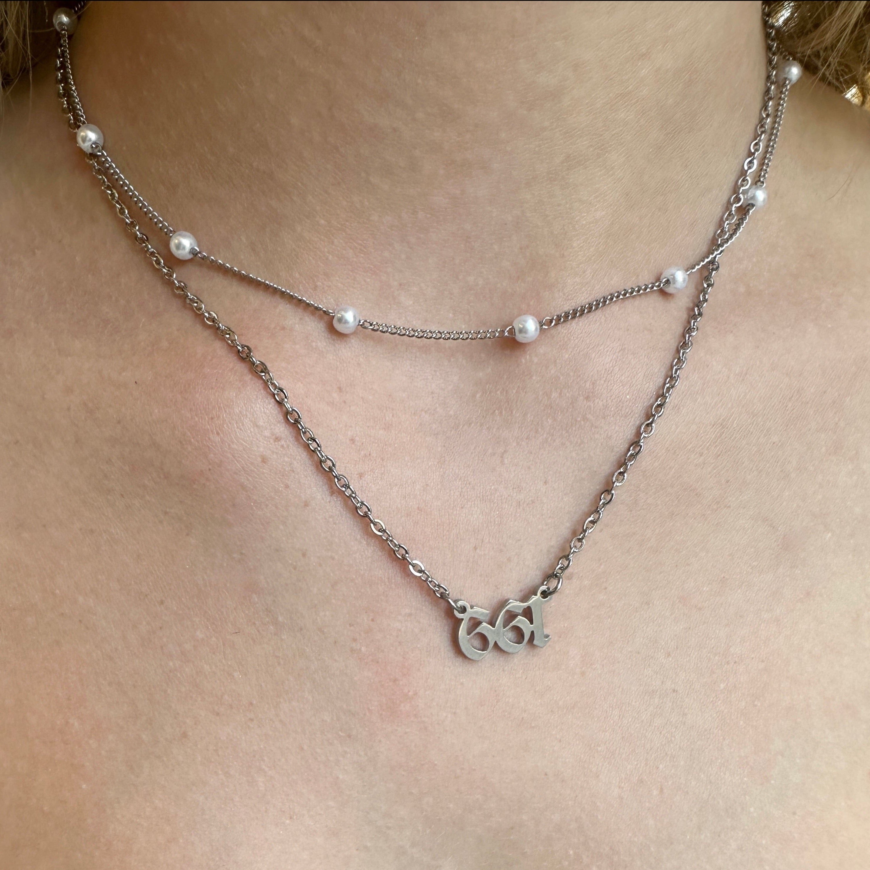 A Closeup of Women Wearing 661 Chain Necklace - FORM + CONTENT