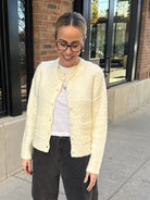 cozy fuzzy white front button cardigan with front pockets 