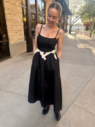 moon river black midi dress with two white bows 