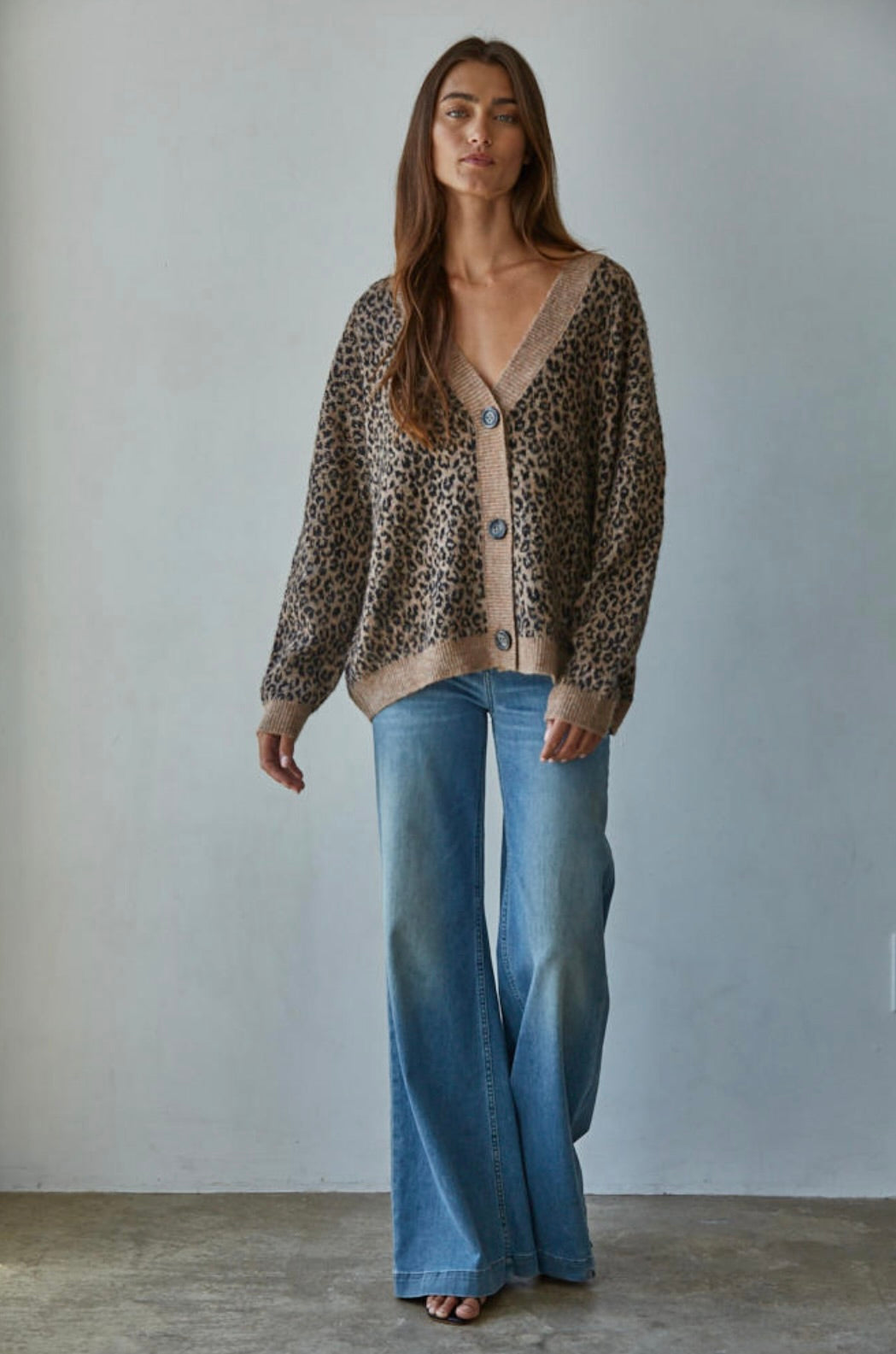 V-neck beauty features a bold animal print that instantly elevates any outfit.